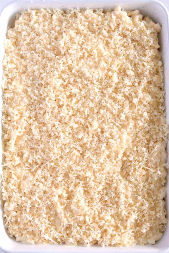 Top down view of assembled macaroni and cheese with unbaked topping.