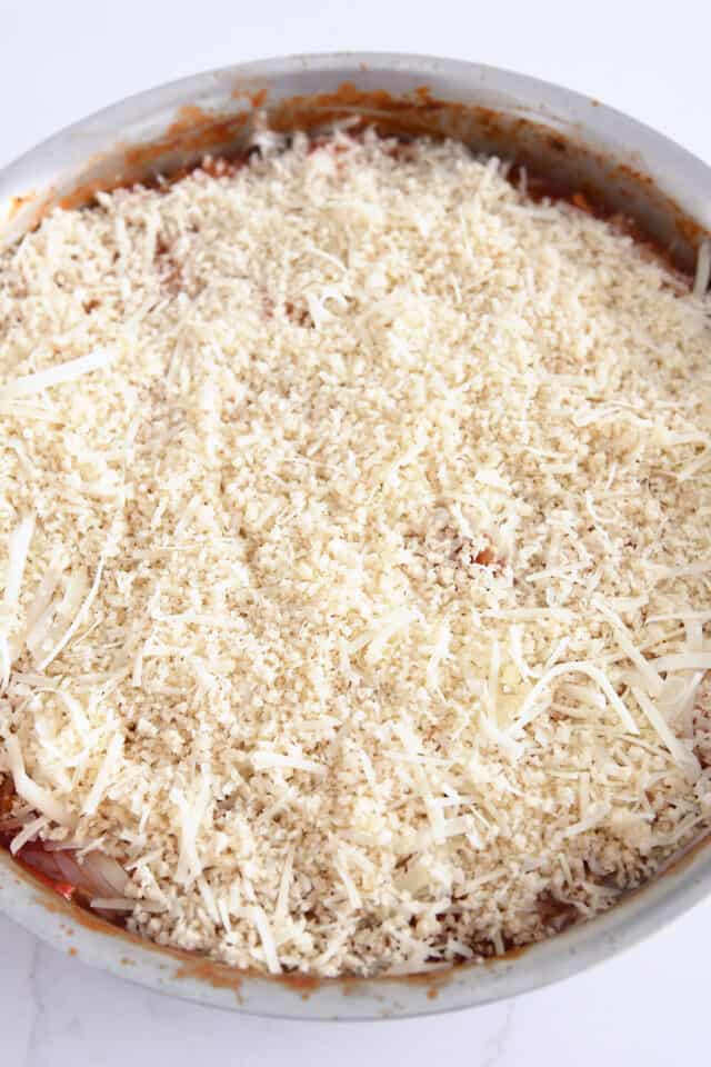 Pank bread crumbs and parmesan cheese on top of skillet meal.