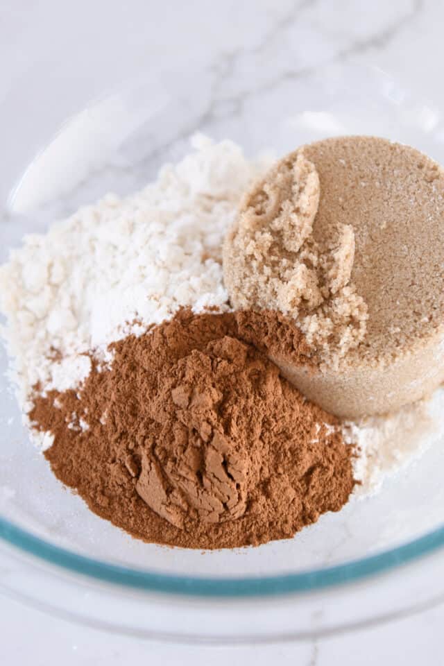 Glass bowl with brown sugar, flour and cinnamon.