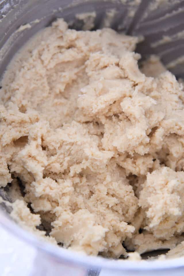 Sugar cookie dough in stainless bowl.