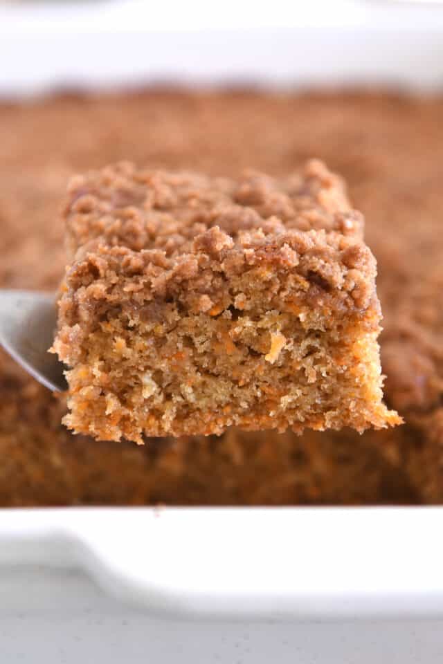 Square of carrot cake coffee cake on metal spatula.