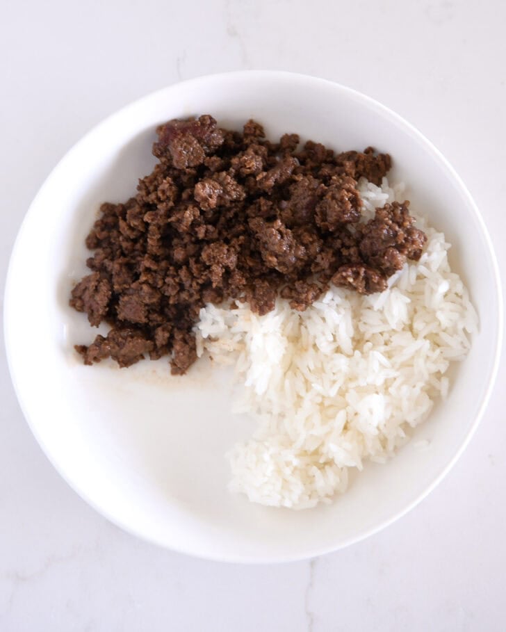 White bowl with white rice and Korean ground beef.