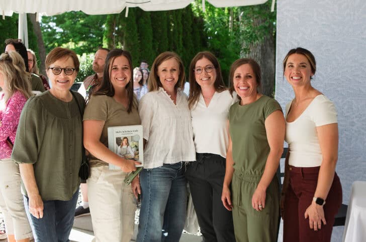 Mel with book signing guests.