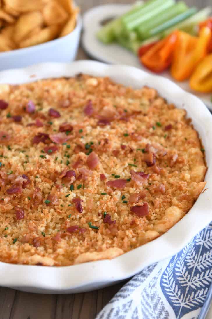 Baked bacon jalapeno popper dip in deep white pie plate.