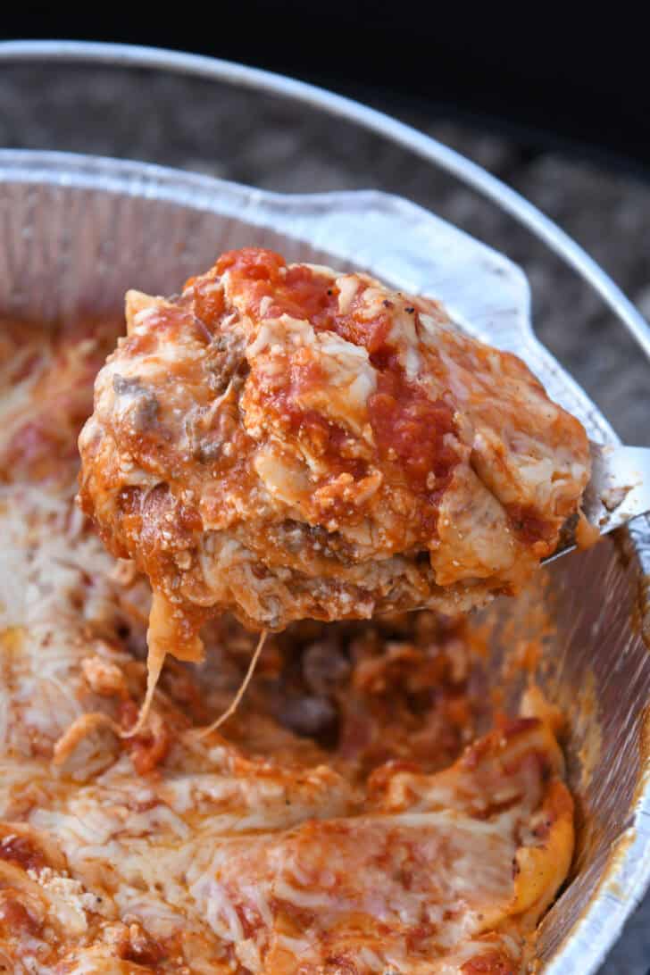 Spoonful of Dutch oven lasagna.