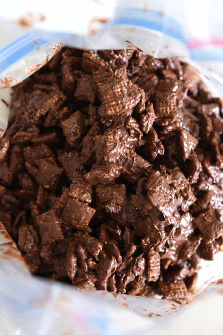 Peanut butter and chocolate coated chex cereal in ziploc bag.