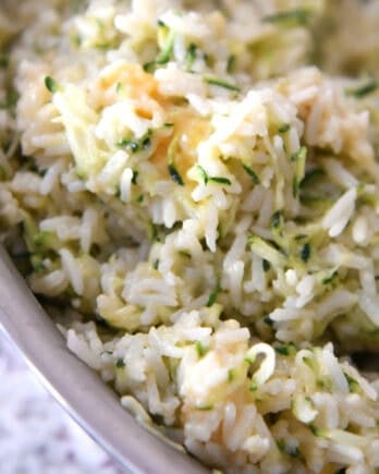 Top view of a pot filled with cheesy zucchini rice.