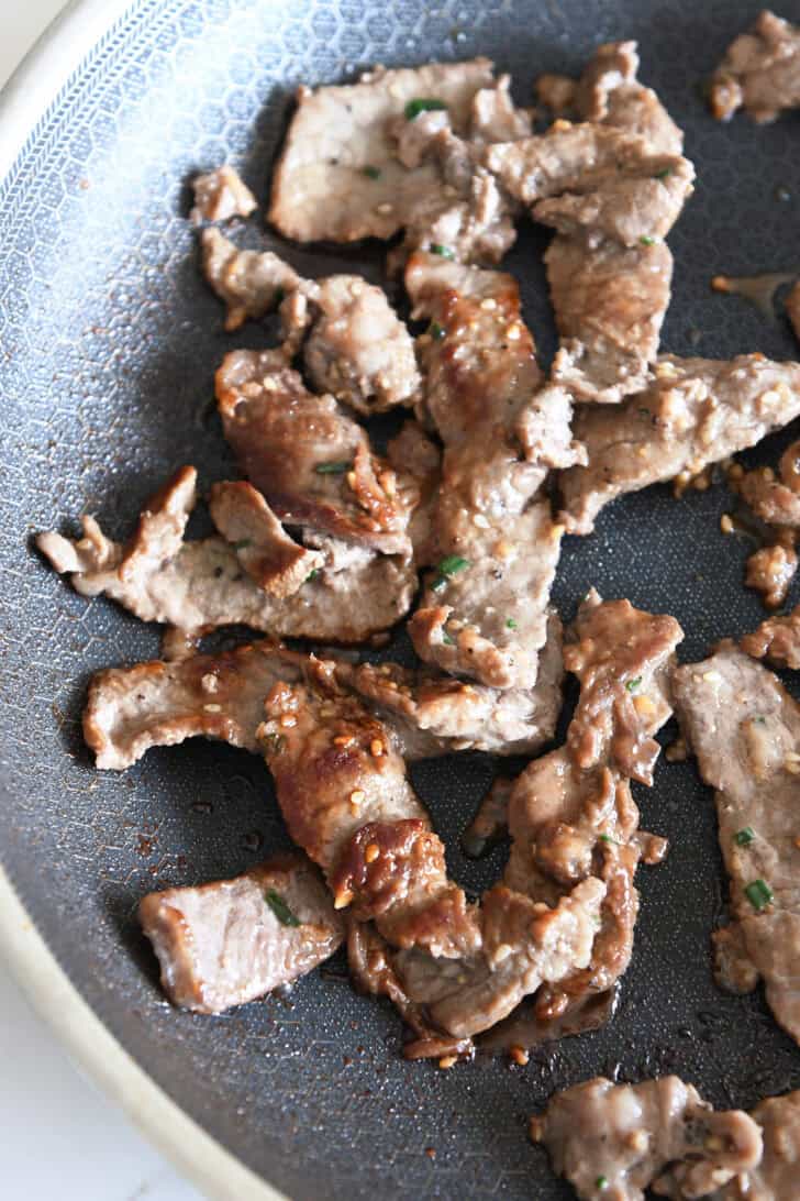 Pan seared pieces of beef in nonstick skillet.