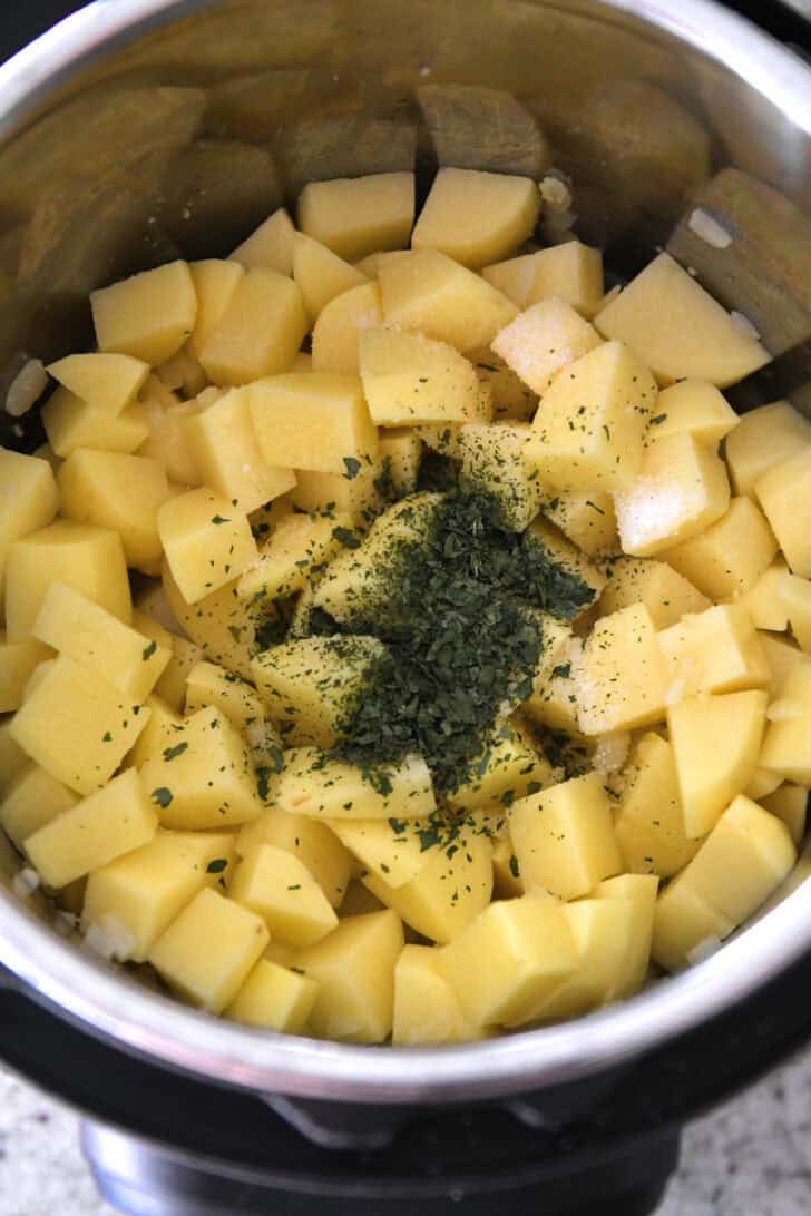 Potatoes, salt, dried parsley and water in Instant Pot.