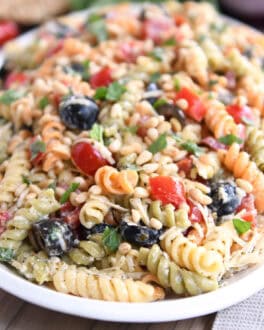 Tri-color pasta salad on white platter.