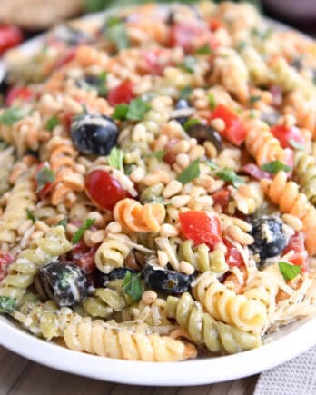 Tri-color pasta salad on white platter.