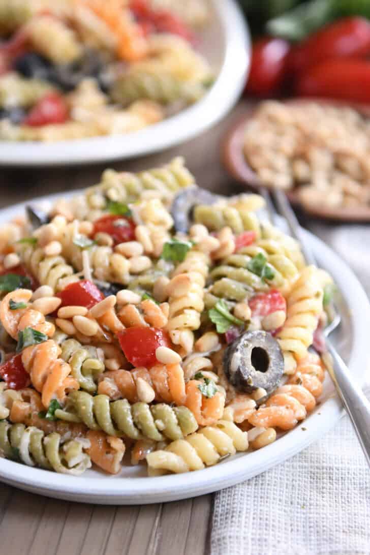 Serving of pasta salad on gray plate.