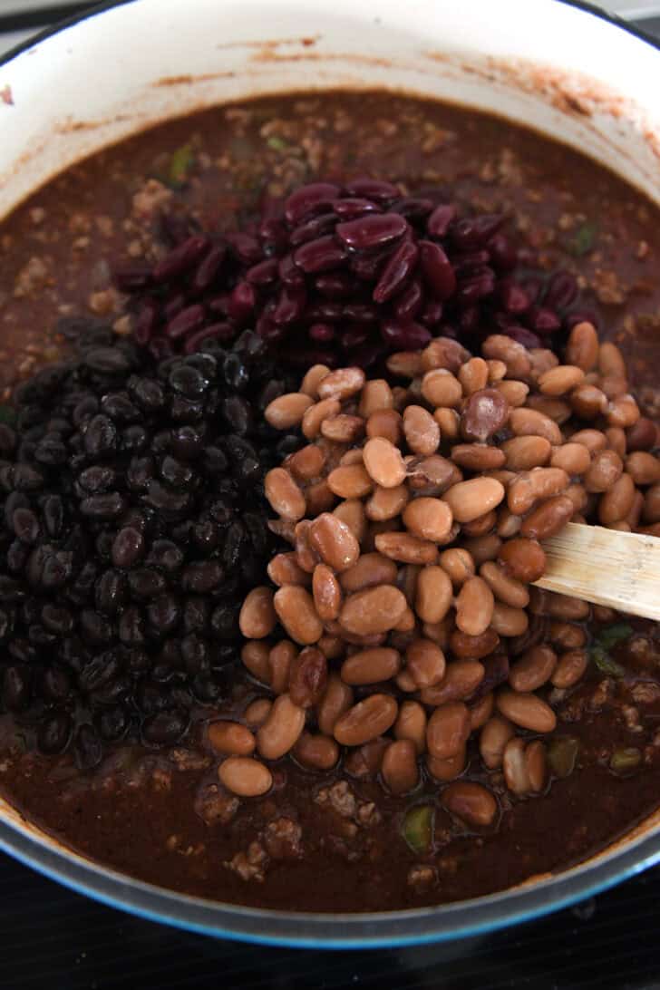 Pinto beans, black beans and kidney beans in chili pot.
