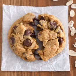 Top down view of pumpkin oatmeal chocolate chip cookie split in half.