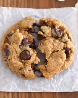 Top down view of pumpkin oatmeal chocolate chip cookie split in half.