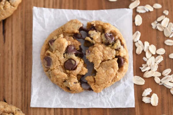 Top down view of pumpkin oatmeal chocolate chip cookie split in half.