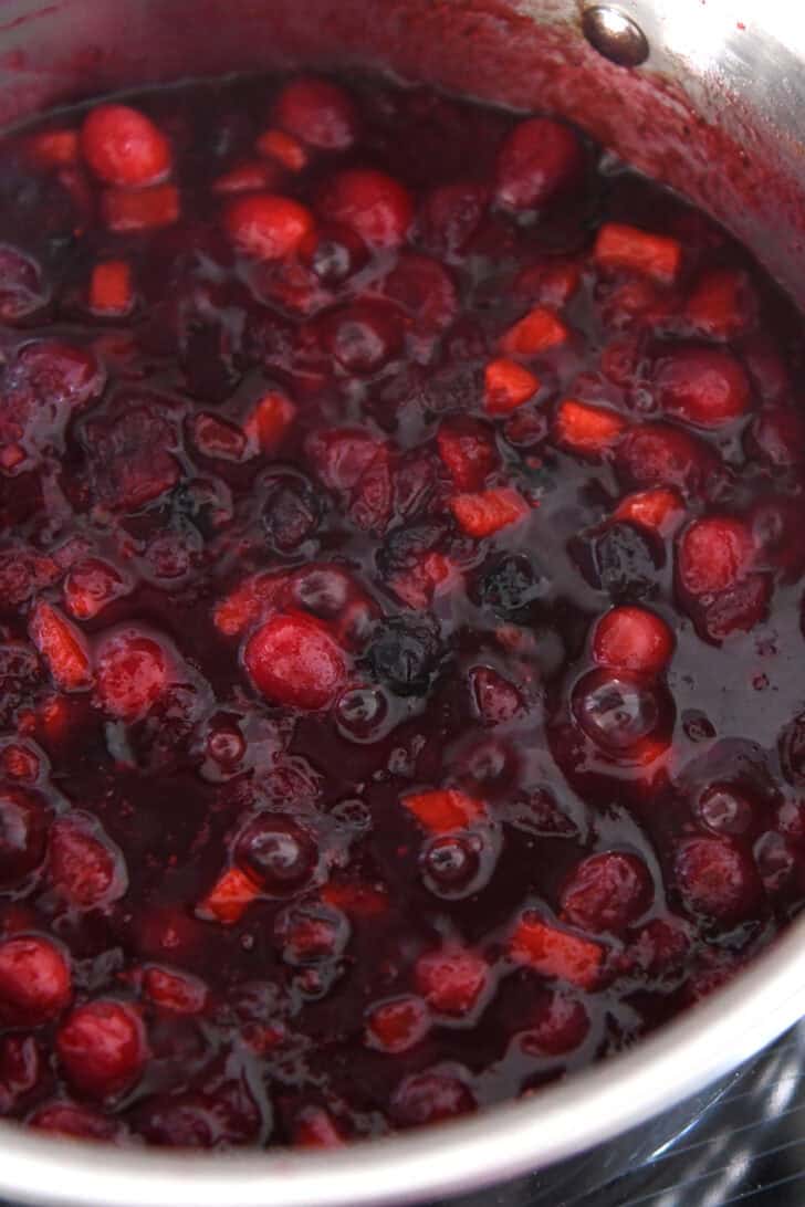 Thick mixture of boiled cranberries, sugar, cinnamon, apples and celery.