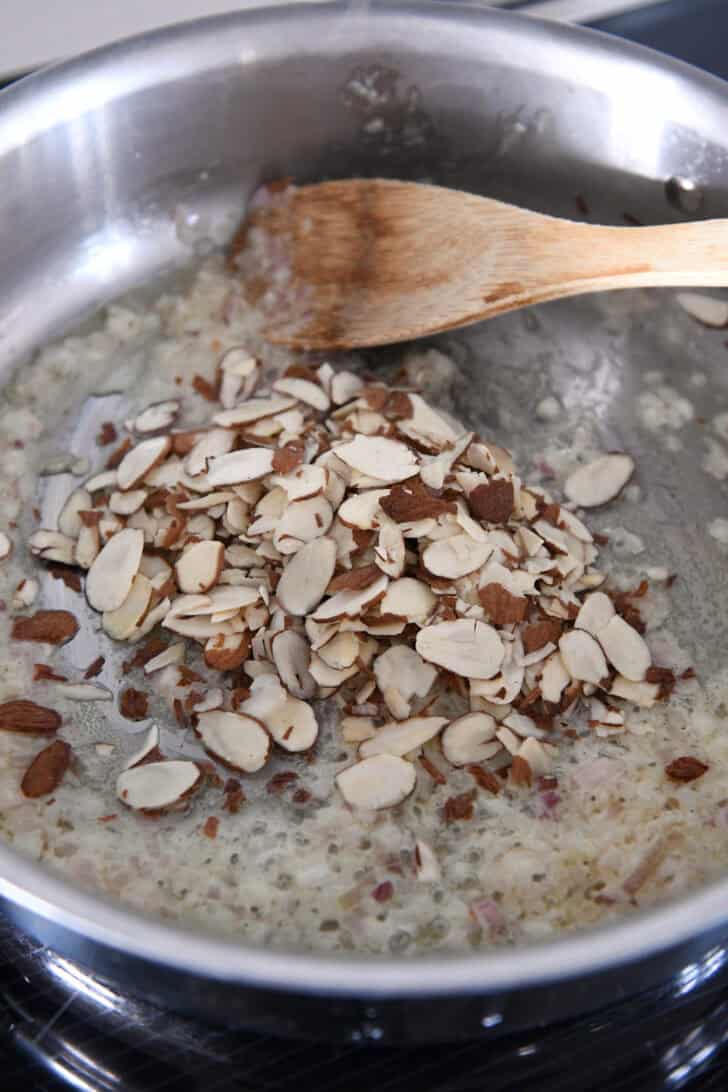 Slivered almonds in butter, shallots and garlic.