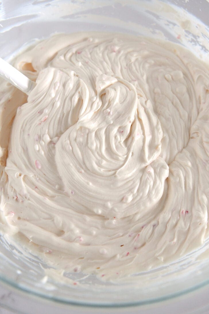 Glass bowl with cream cheese peppermint mixture.