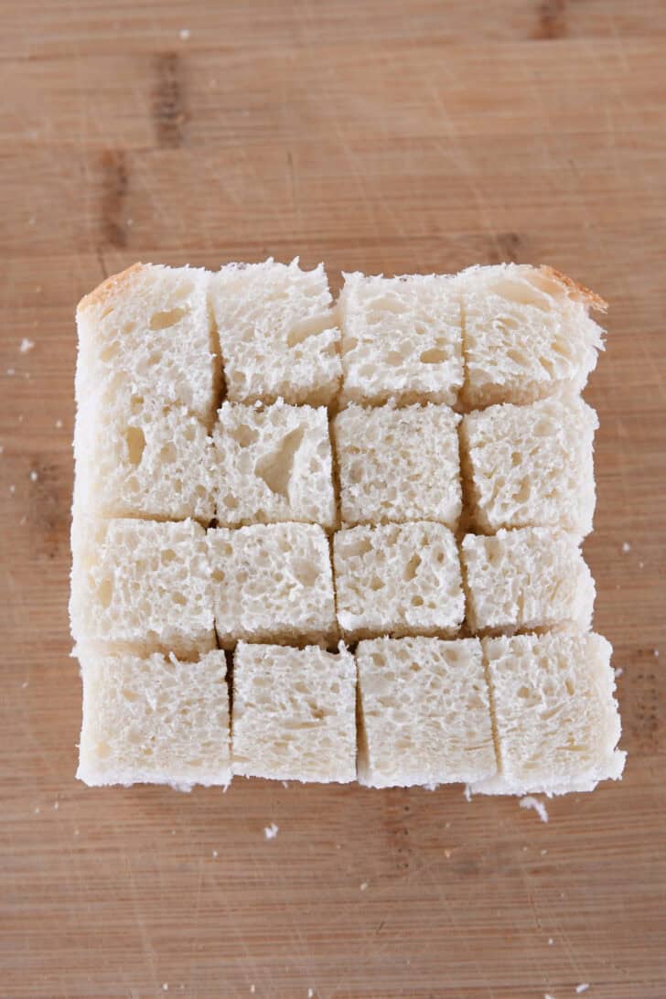 Bread slice cut into 16 cubes.
