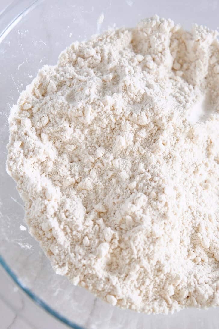 Bowl with flour and small pieces of butter.