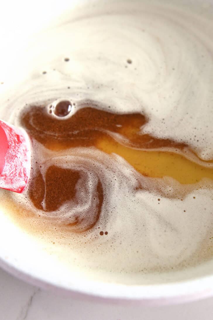Browned butter in white skillet.