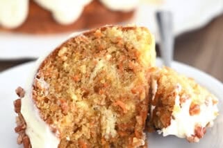 Piece of carrot cake bundt cake on white plate.