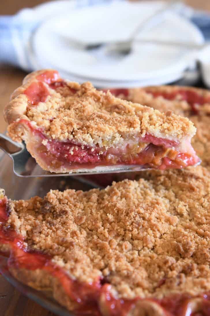 Pie server with slice of strawberry rhubarb pie.