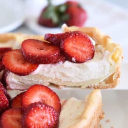 Slice of strawberry cream puff cake on white cake server.