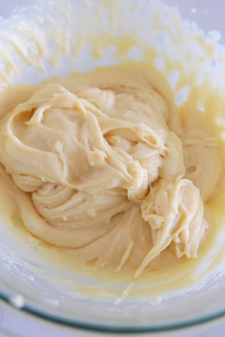 Silky smooth cream puff dough in glass bowl.