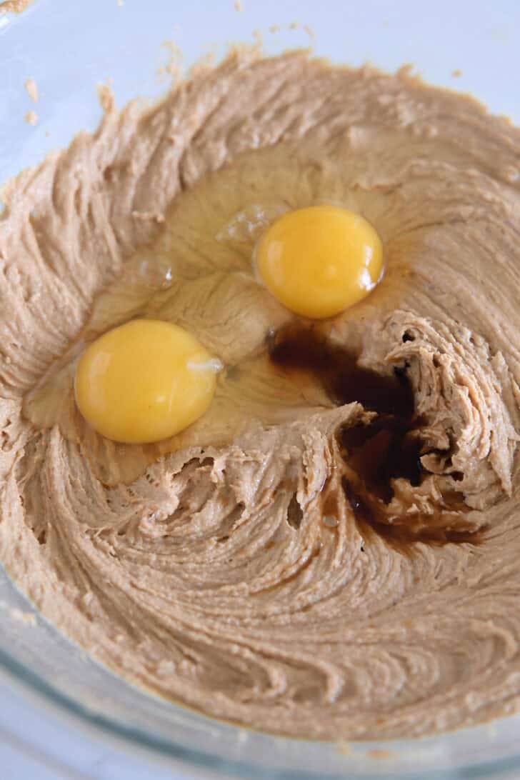 Wet peanut butter cookie dough with eggs and vanilla.