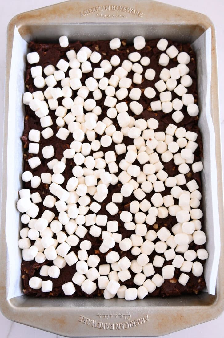 Marshmallows on top of chocolate cookie batter in 9X13-inch pan.