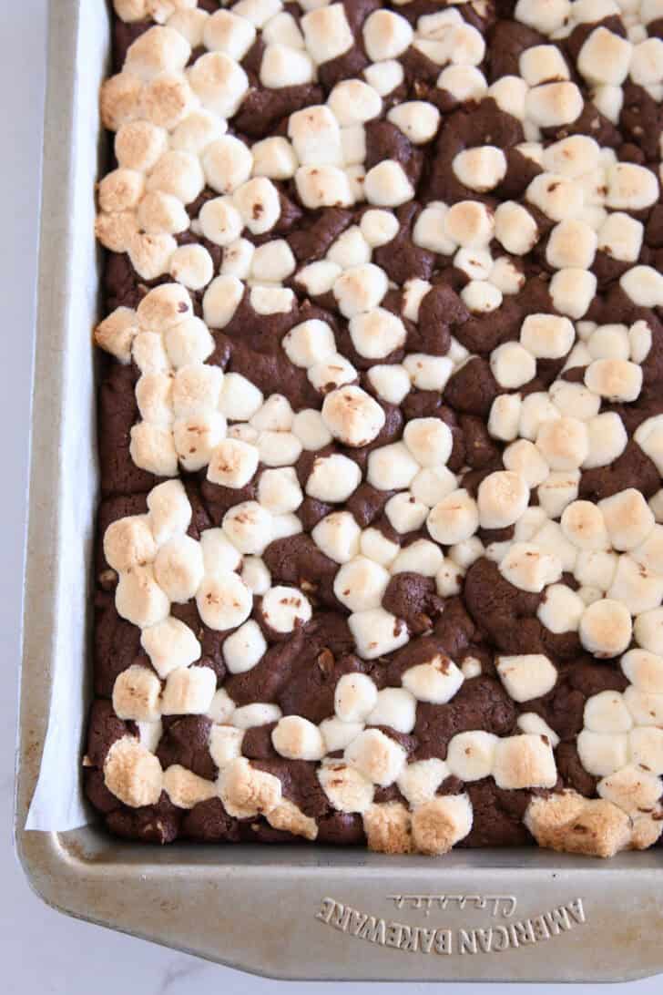 Baked pan of marshmallow-topped chocolate cookie bars.