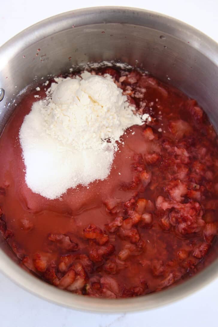 Mashed strawberries, sugar, lemon juice and cornstarch in stainless saucepan.