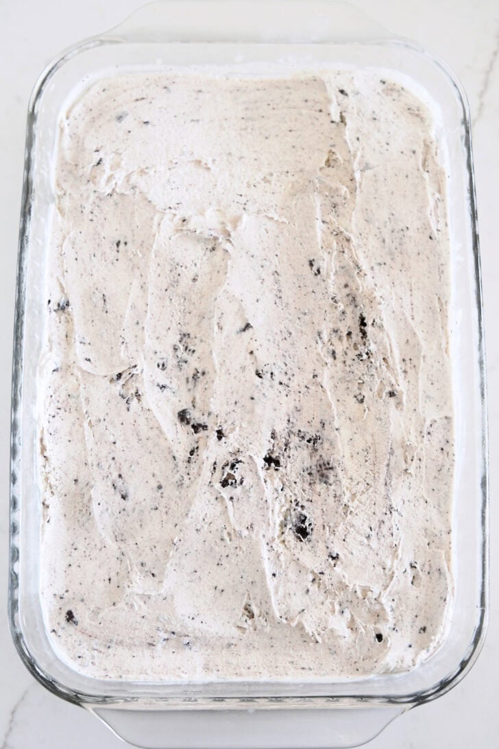 Cookies and Cream ice cream spread evenly in glass 9X13-inch pan.