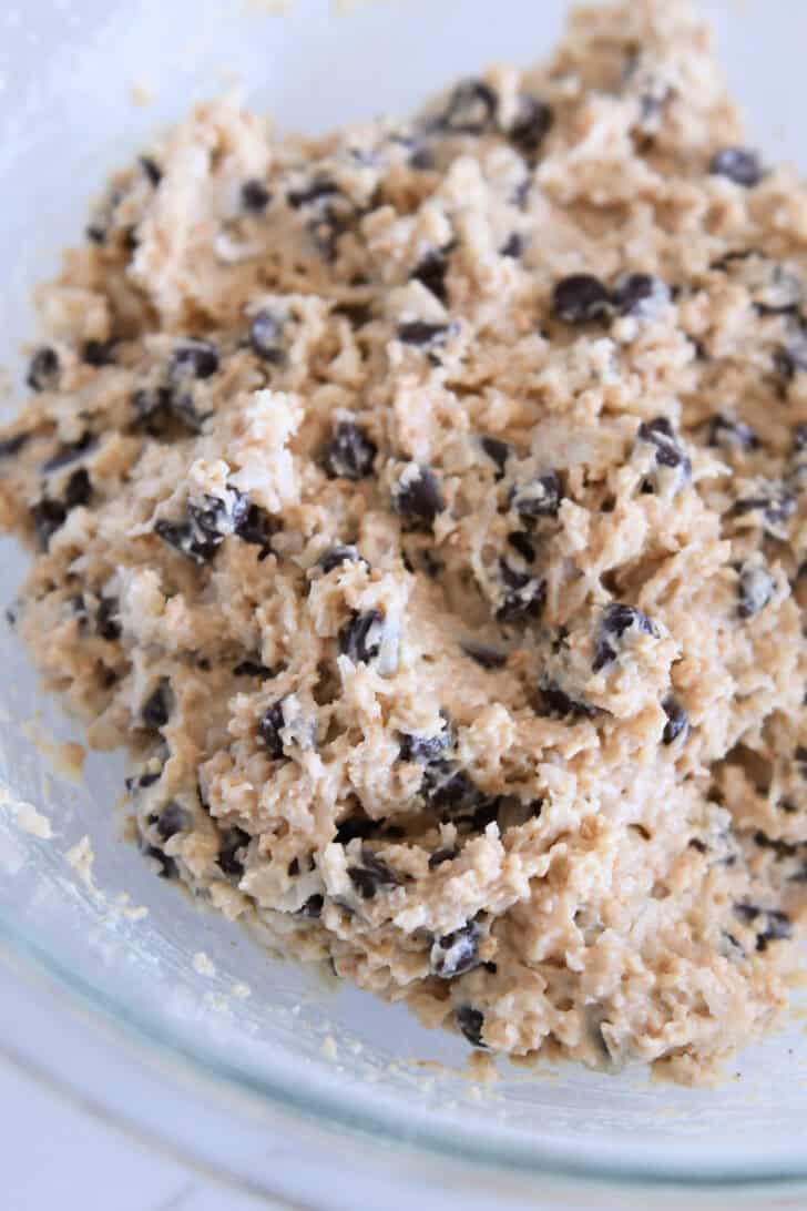 Glass bowl with soft, sticky cookie dough.