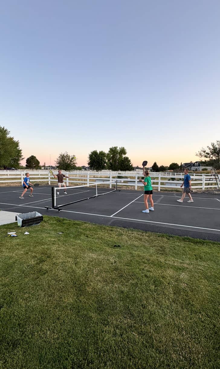 Playing pickleball outside.