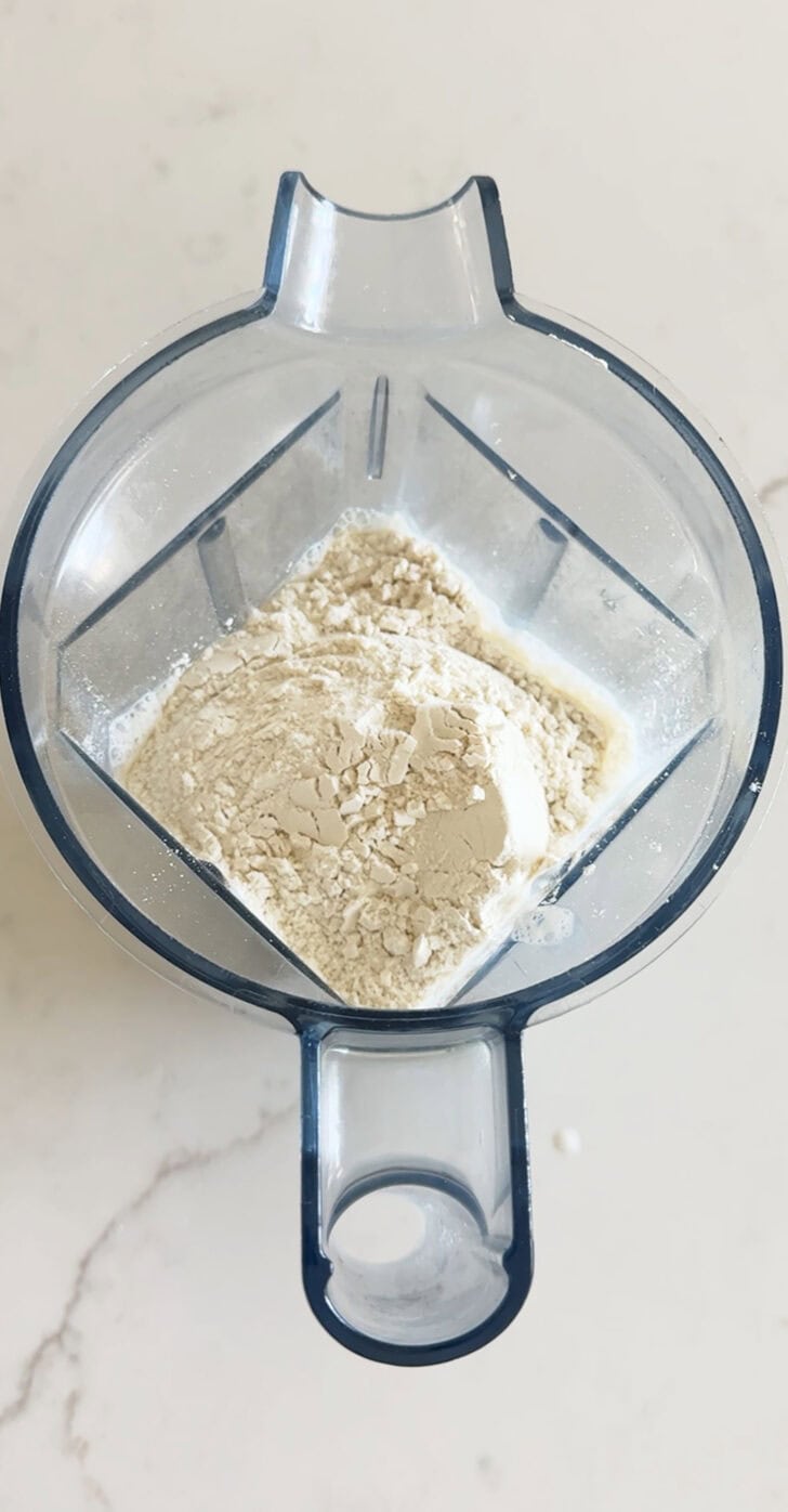 Flour in blender with milk and eggs.