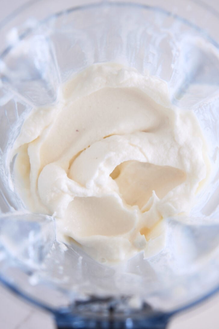 Whipped mixture for frosted lemonade in blender.