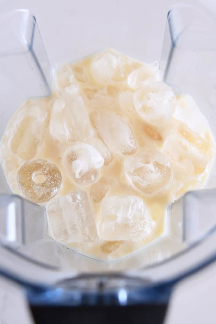 Blender with ice, pineapple juice, cream of coconut, half-and-half.