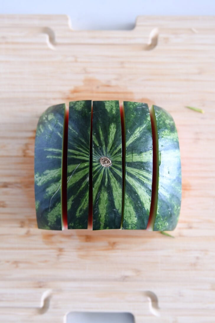 One half of a watermelon cut into five strips.