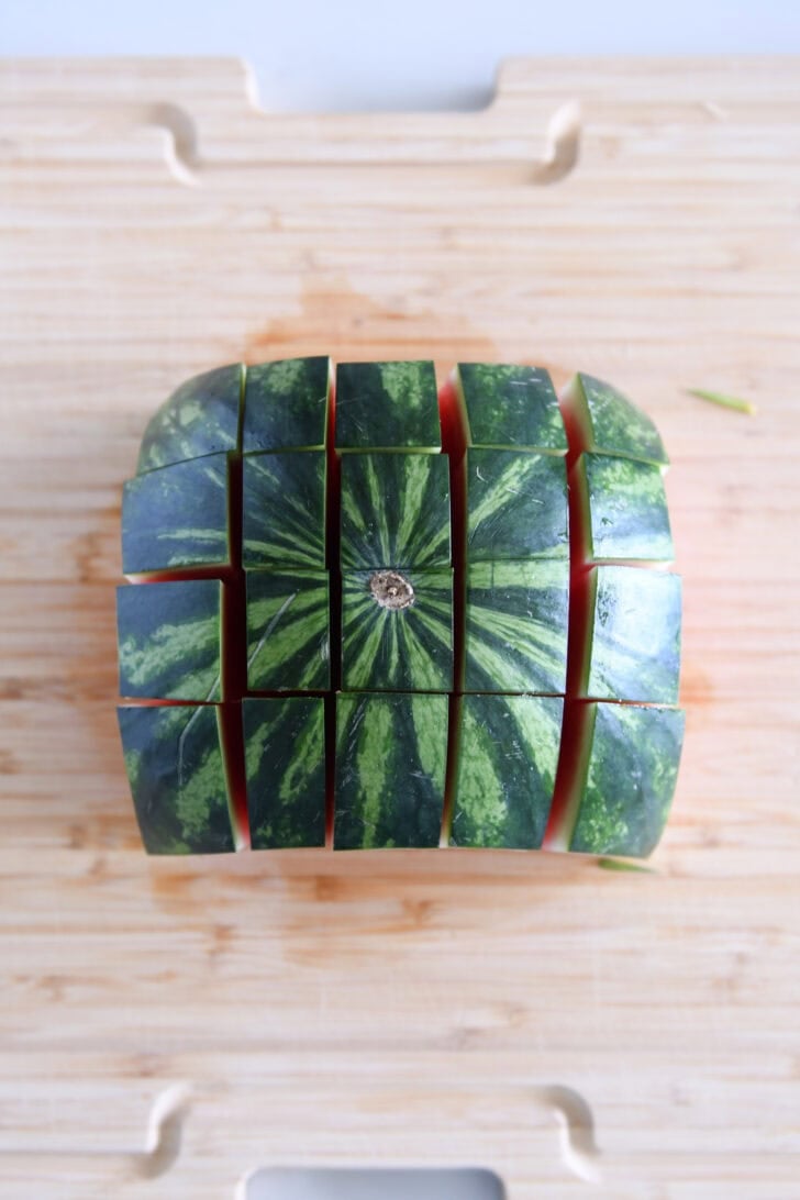 One half of a watermelon cut into 20 pieces.
