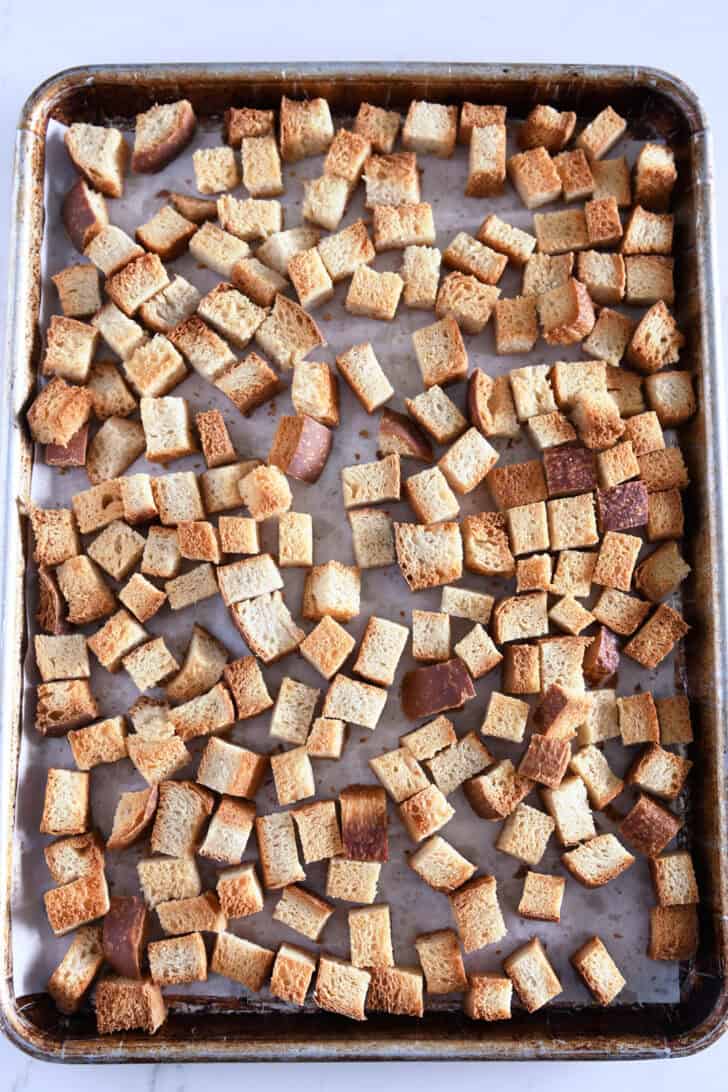 Sheet pan with toasted bread cubes.