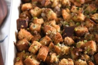 White 9X13-inch pan with baked sausage and herb stuffing.