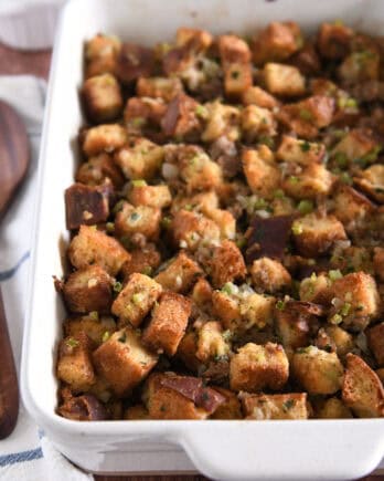 White 9X13-inch pan with baked sausage and herb stuffing.