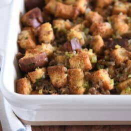 White 9X13-inch pan with baked sausage and herb stuffing.