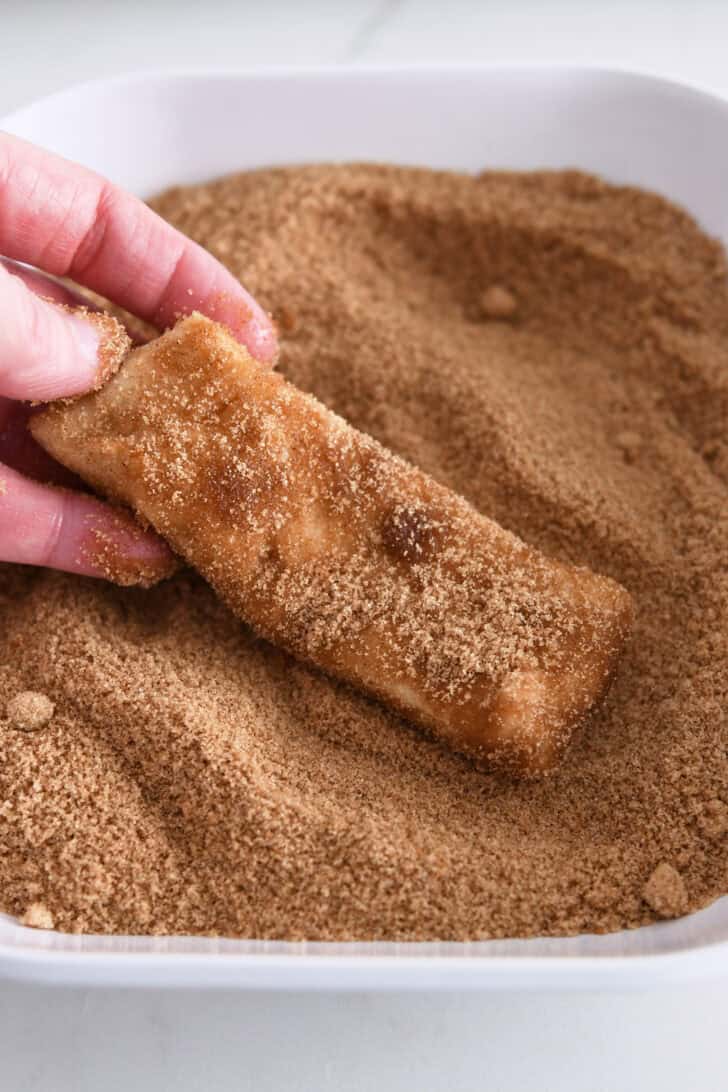 Piece of dough dipped in cinnamon and sugar.