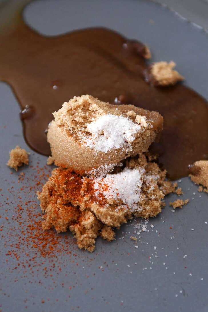 Brown sugar and spices in a metal pan.