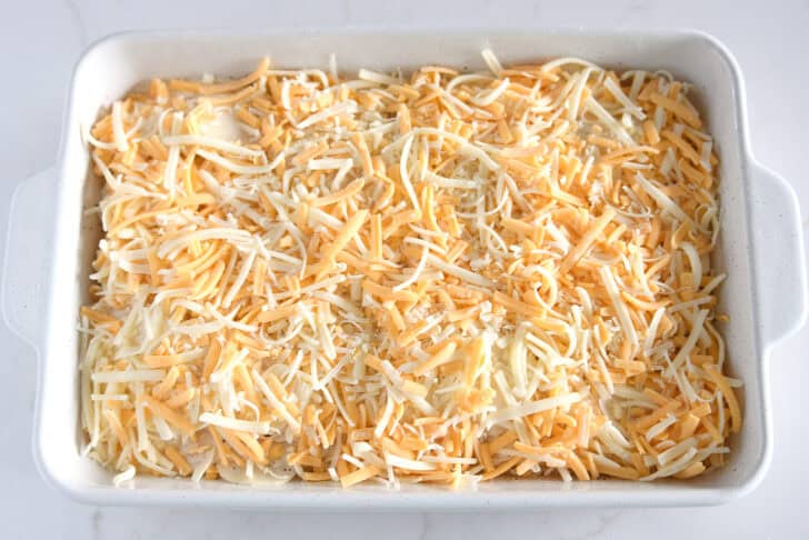 Shredded cheese layered over thin slices of au gratin potatoes.