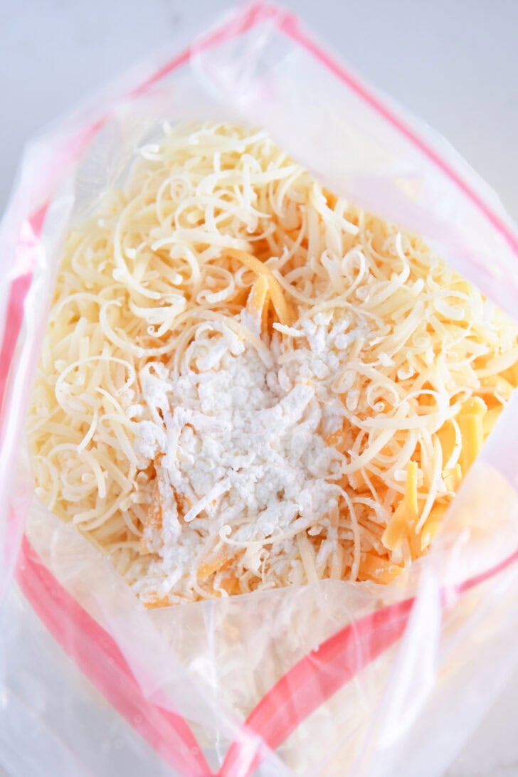 Ziploc bag of shredded cheese with cornstarch.